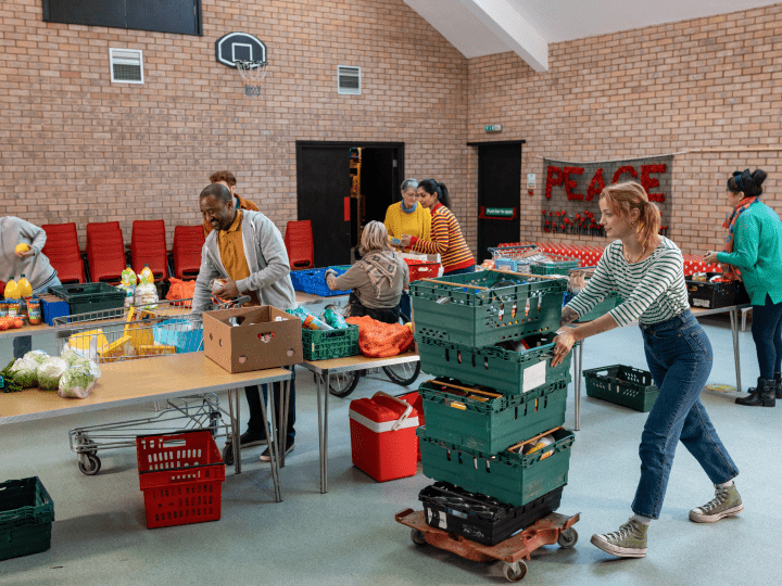 A group of individuals helping at a food bank