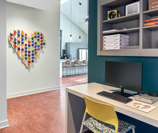 An office space at Harbour House, with large heart-shaped artwork on wall.