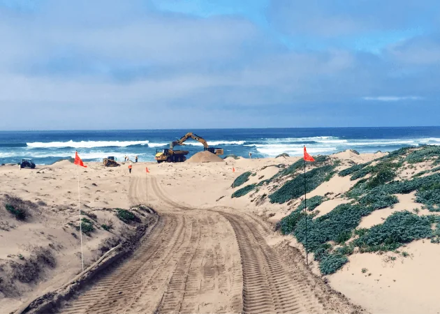 Guadalupe Beach.JPG Excavator machinery working on an oceanfront beach