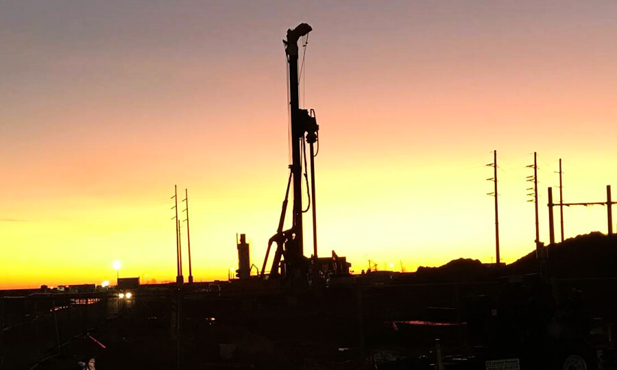 construction equipment with sunset in background