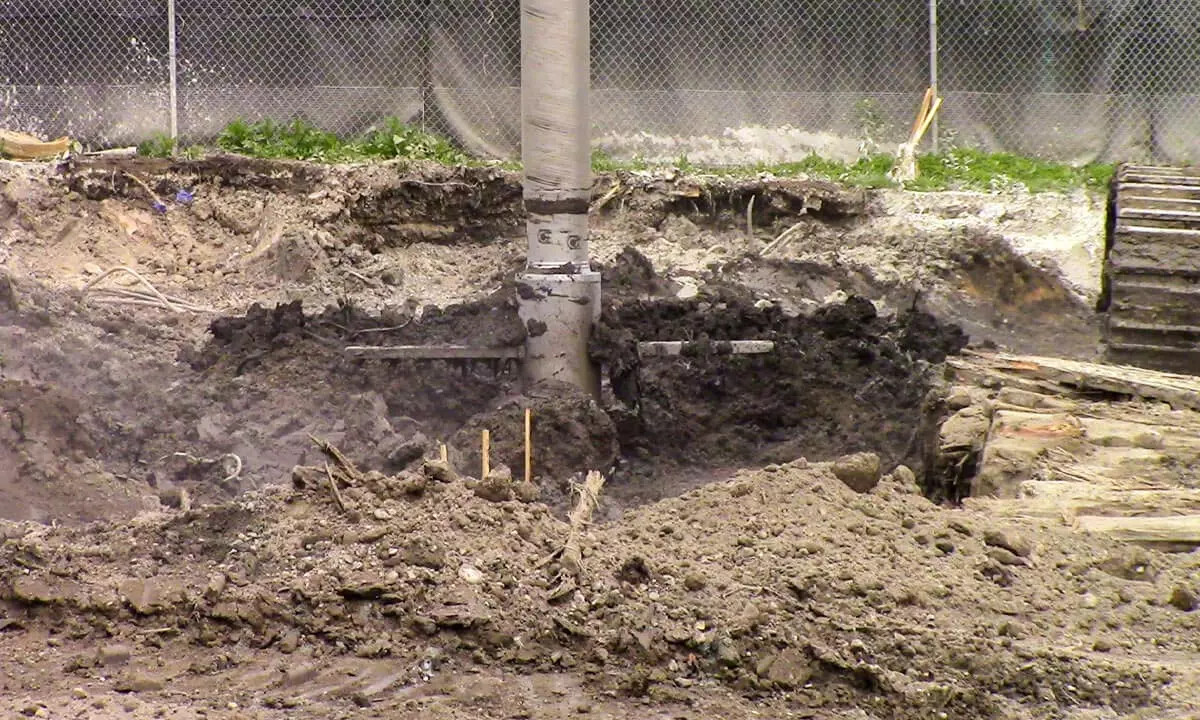 excavator digging a hole