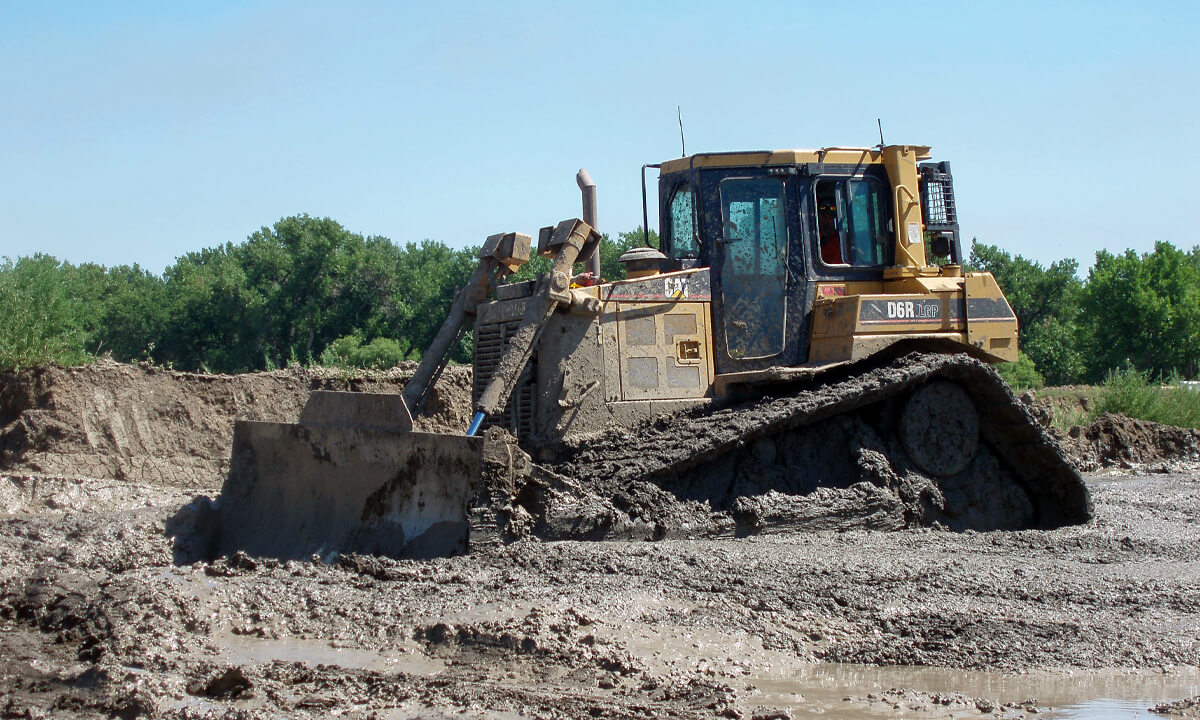 big machinery at a muddy job site